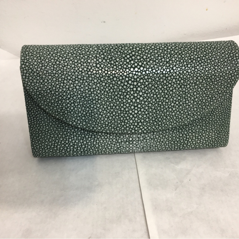 J. Markell Mara  Clutch Bag. Size 1.75”x4.5”x8. Clutch into shoulder. Brand new